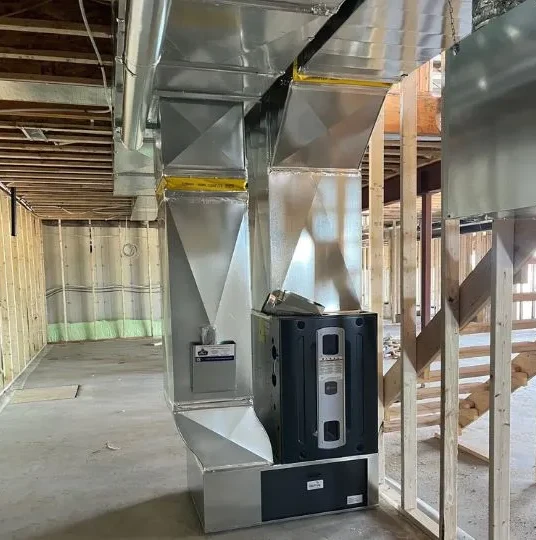 Newly installed furnace in the basement of a home.
