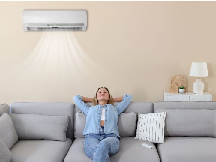 Woman enjoying a new air conditioner