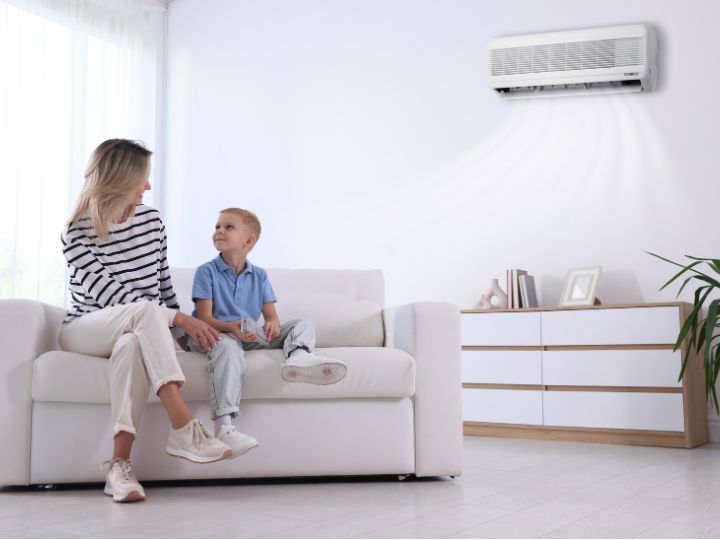 Woman and her son enjoying improved air quality of their air conditioner