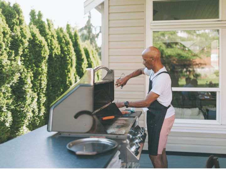 Man cooking on a Barbecue outside
