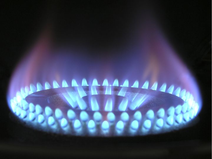 Close-up of gas stove turning on