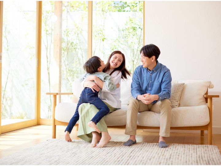 Family enjoying time in air conditioned house