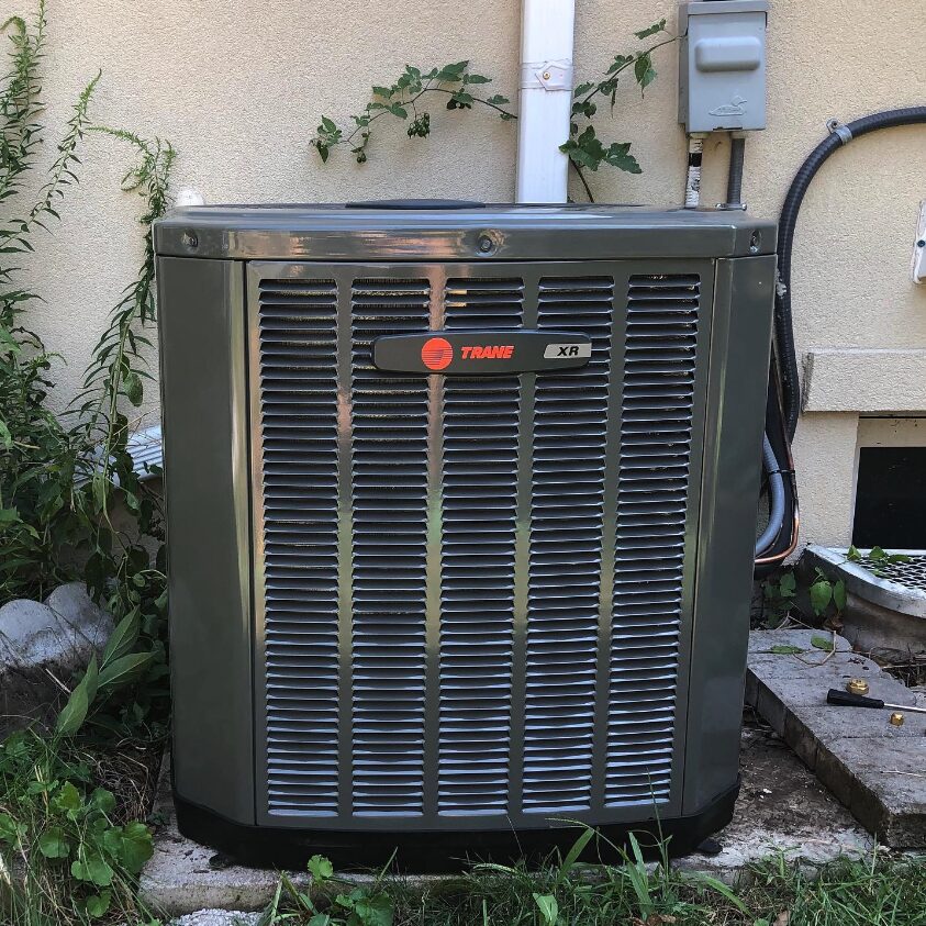 Photo of newly installed Trane air conditioner outside a home.