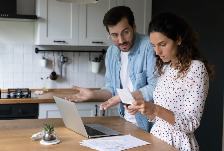 Couple looking at documents and trying to make decision